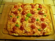 Pizza aux tomates cerises et au jambon cru italien