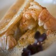 Ravioles de langoustines et son bouillon d’artichaut  